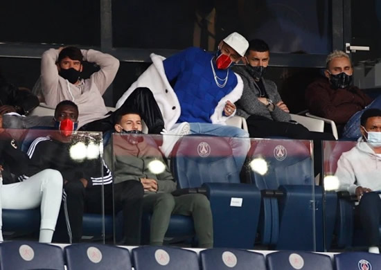 Suspended PSG star Neymar wears huge furry white coat as he cheers on team-mates against St Etienne from the stands