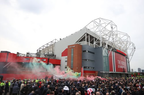 Man Utd fans descend on Old Trafford in protests and set off flares ahead of Liverpool clash