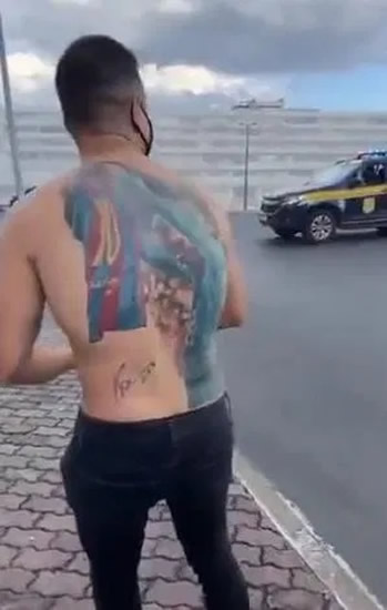 LIONEL MESSI made one superfan's day... by signing his BACK.