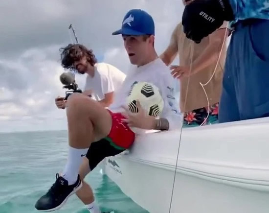 Christian Pulisic fall off boat onto huge fish while juggling ball as Jadon Sancho trolls Chelsea star