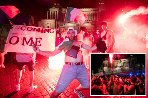 Italy fans go wild and hold up ‘football’s coming Rome’ signs as they celebrate Euro 2020 win over England at home