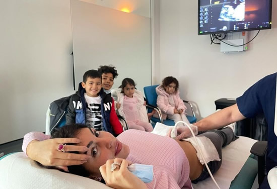 Georgina Rodriguez smiles during scan on twins in hospital while Cristiano Ronaldo's four children watch on