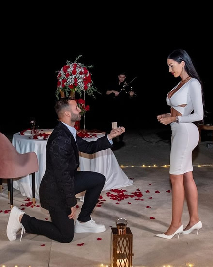 Premier League flop gets engaged to busty model he took to court for harassment