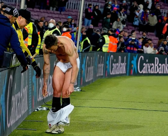Sevilla star Ivan Rakitic strips down to just his underwear on pitch as he gifts full kit to fans after Barcelona defeat