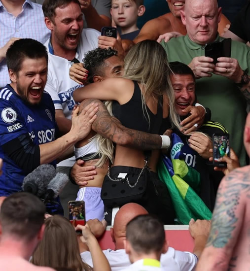 Romantic Raphinha rushes to hug fiancee Taia Rodrigues in crowd after helping Leeds clinch Premier League safety