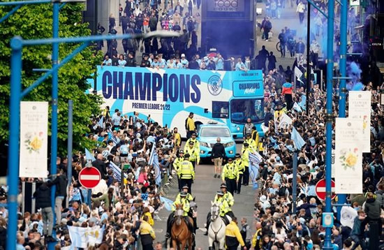 Pep Guardiola puffs on cigar with backroom staff as Man City celebrate with title parade