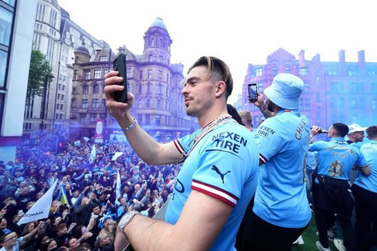 Pep Guardiola puffs on cigar with backroom staff as Man City celebrate with title parade