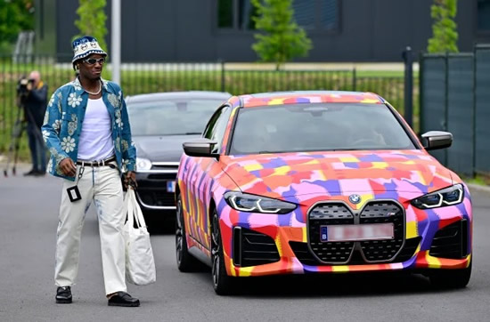 BATMOBILE Chelsea star Michy Batshuayi has plush BMW spray-painted in striking RAINBOW colours as he arrives for Belgium training