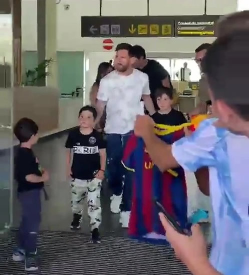 PSG star Lionel Messi returns to Barcelona with family and is greeted by adoring fans at airport