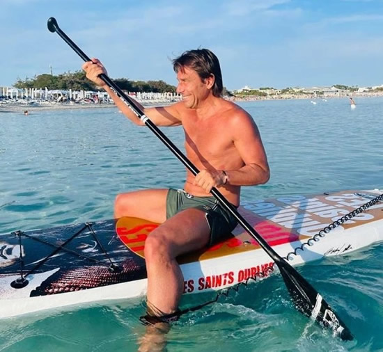 HOLIDAY MODE Grinning Antonio Conte goes paddle boarding as Tottenham manager relaxes on family holiday