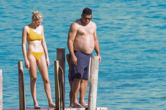 SUNNING IT UP Brazil legend Ronaldo relaxes on beach with wife Celina aged 45 as pair frolic in the sea while enjoying sun