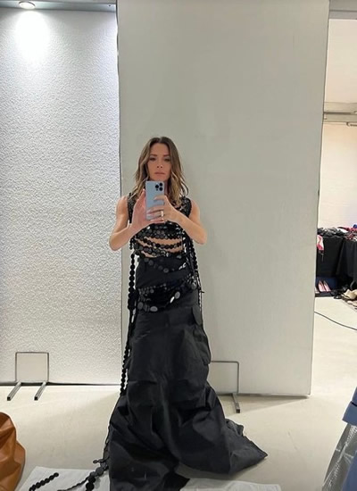 Victoria Beckham sizzles in skintight leather trousers as she dons teeny crop top