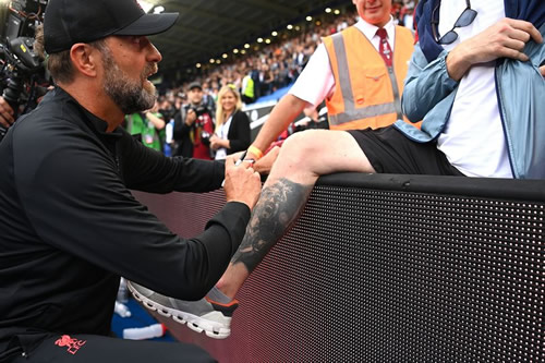 Jurgen Klopp signs giant tattoo of himself on obsessed Liverpool fan's body