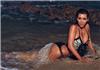 Beach babe ... Kim Kardashian's 'Night Shoot' Tweet to fans