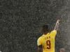 Cameroon's Eto'o gestures in the rain during their 2014 World Cup Group A soccer match against Mexico at the Dunas arena in Natal