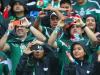 Mexico fans take pictures during the match