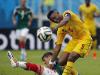 Cameroon's Samuel Eto’o (9) collides with Mexico's Hector Moreno during first halfMexico's 