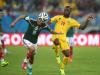 Oribe Peralta of Mexico controls the ball against Aurelien Chedjou of Cameroon