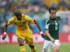 Andres Guardado of Mexico controls the ball against Stephane Mbia of Cameroon