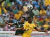 Francisco Javier Rodriguez of Mexico and Samuel Eto'o of Cameroon go up for a head ball
