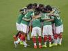 Mexico's team confer to the match