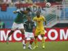 Mexico's Francisco Rodriguez, Mexico's Jose Juan Vazquez and Cameroon's Enoh Eyong fight for the ball