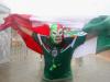 A Mexico fan braves the rain