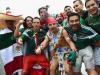 Mexico fans cheer in the rain