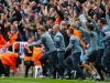 Joy and relief are etched on the faces of the Newcastle bench, including manager John Carver, left, as they celebrate after Jonás Gutiérrez (not pictured) scored the Magpies’ second goal in a 2-0 win over West Ham. The win meant they escaped relegation to the Championship.