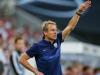 The energetic Klinsmann instructs the visiting side from the touchline