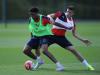 Chuba Akpom and Gabriel tussle for possession