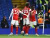 Arsenal celebrate their fourth goal at Chelsea Credit: Reuters