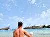 Sergio Asenjo with his child on a beach.